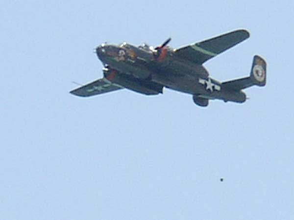 Kermit Weeks B25 Apache Princess dropping bombs (watermelons.)