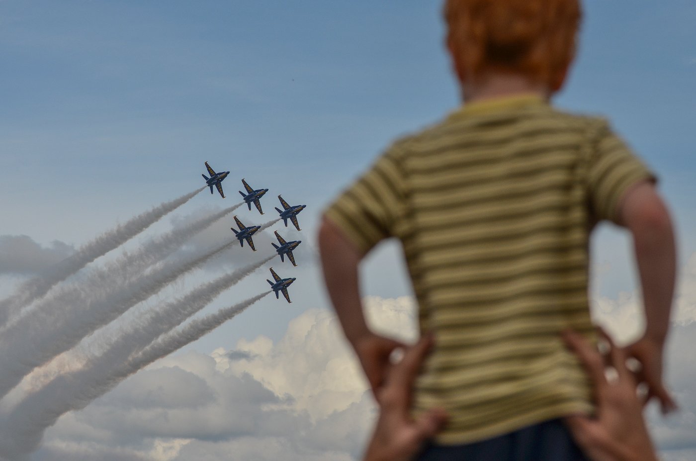 Blue Angels inspire lots of folks, particularly children. So at the 2017 Wings Over North Georgia show there were several kids on shoulders watching them perform. I decided to make this red head kid a part of the Blue's Delta shot.