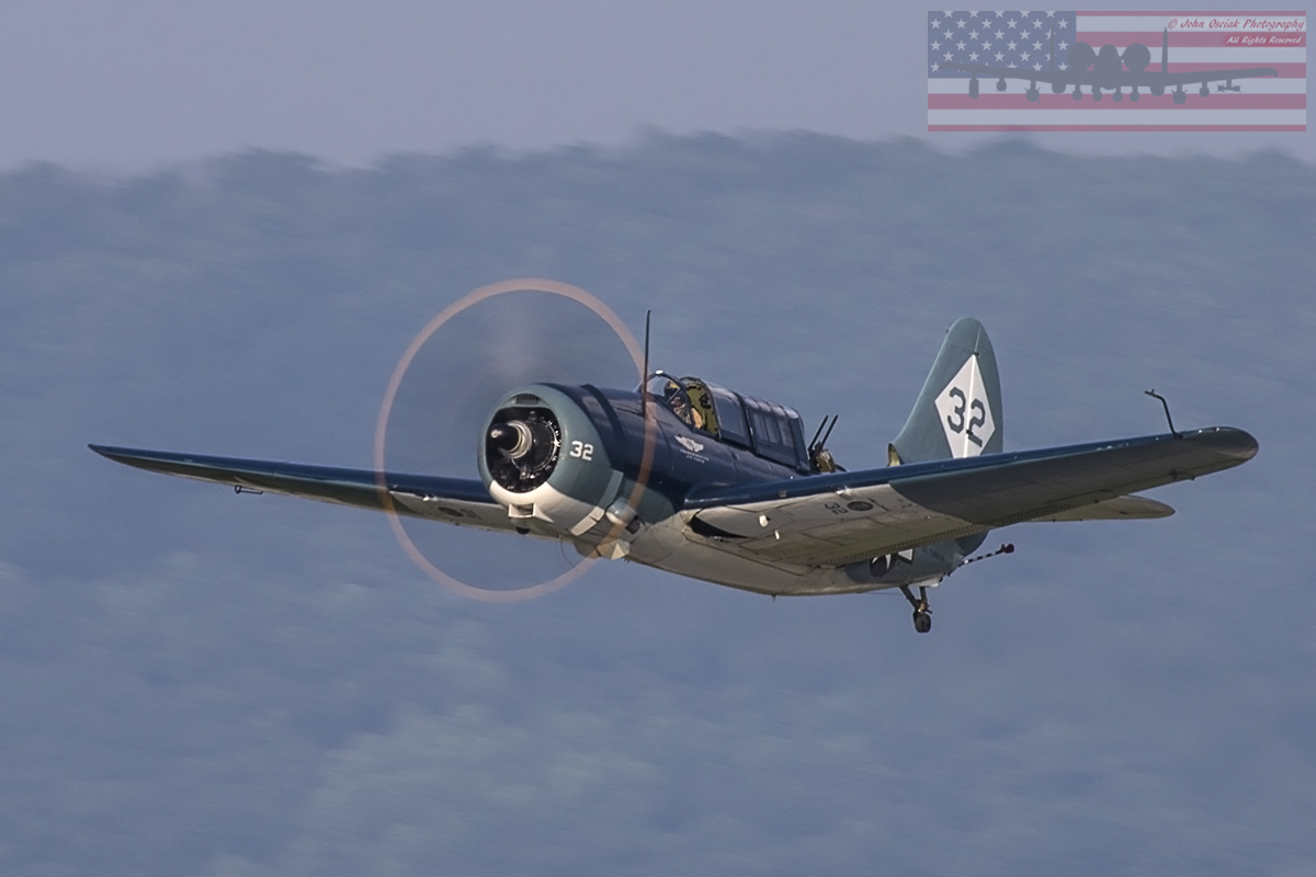 CAF SBD2C-5 Helldiver warbird flight taking off into the late afternoon sun.