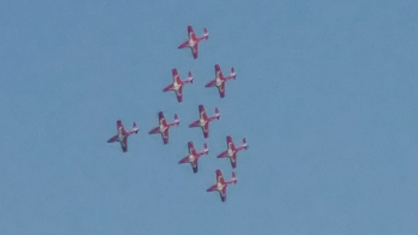 Snowbirds coming around in 9 plane formation